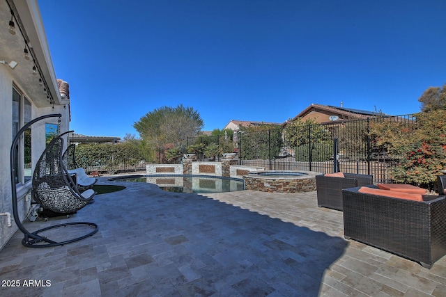 view of patio with a swimming pool with hot tub