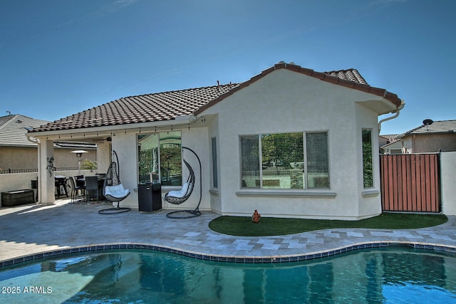 rear view of property with a patio area