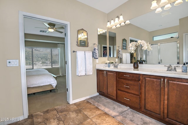 bathroom with vanity, ceiling fan, and a shower with shower door