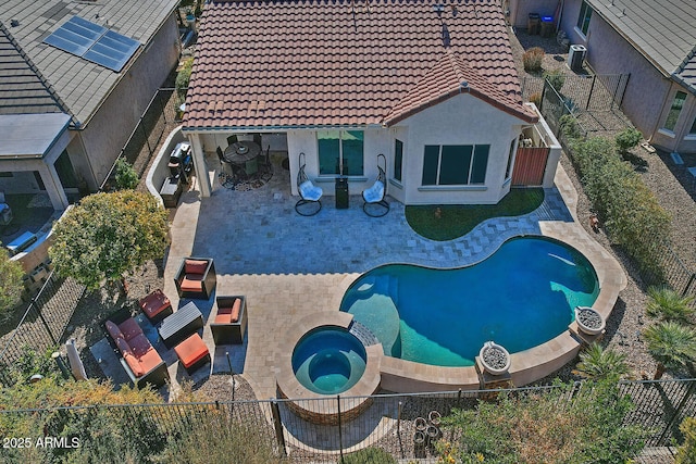 view of pool with an in ground hot tub, central AC unit, and a patio