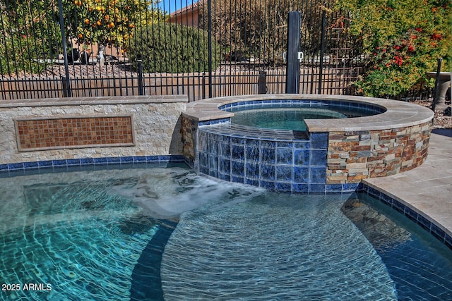 view of pool featuring an in ground hot tub