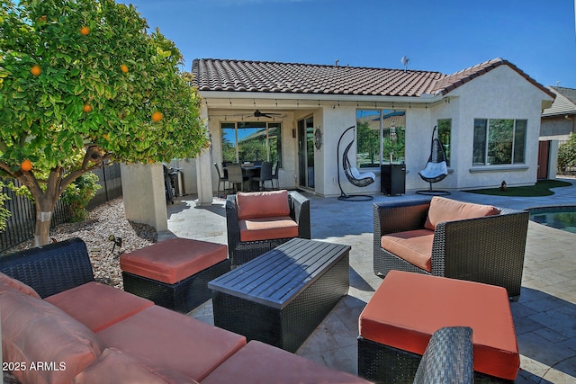 view of patio / terrace with an outdoor living space and ceiling fan