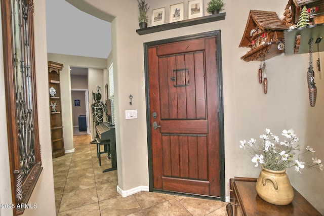 entryway featuring light tile patterned flooring