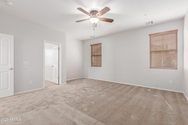 unfurnished bedroom featuring baseboards, visible vents, and carpet