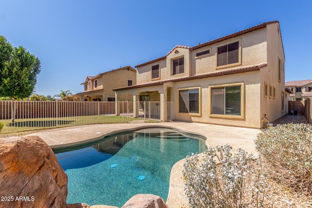 view of swimming pool featuring a fenced in pool, a fenced backyard, and a patio area