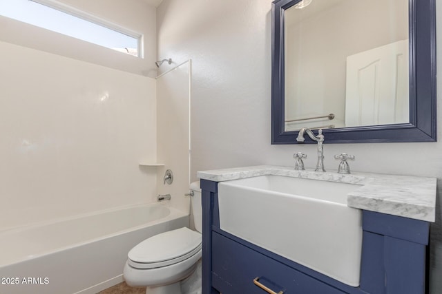 bathroom with toilet, vanity, and shower / bathtub combination