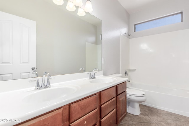 bathroom with tile patterned flooring, toilet, a sink, double vanity, and washtub / shower combination