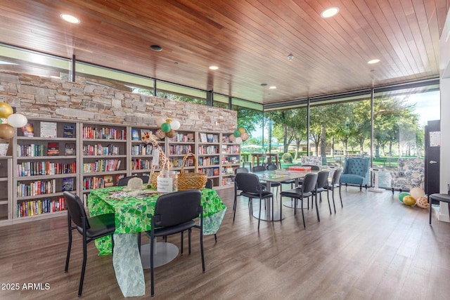 dining room featuring floor to ceiling windows, wood finished floors, wood ceiling, and recessed lighting
