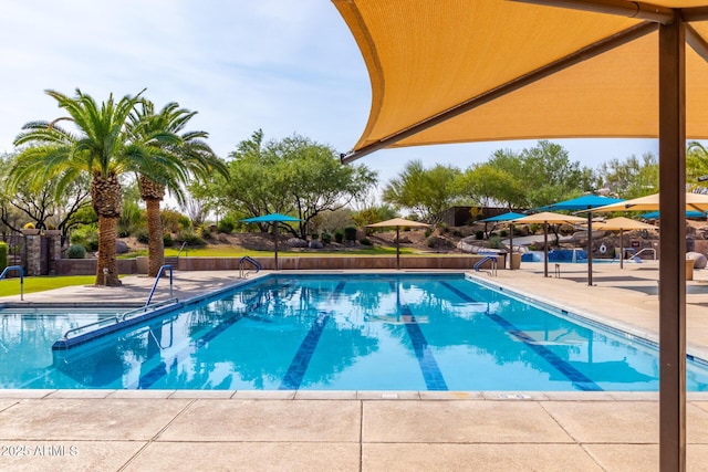 pool with a patio area