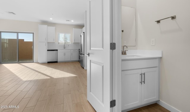 bathroom featuring sink and wood-type flooring