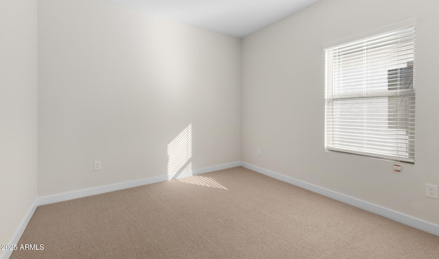 carpeted spare room with a wealth of natural light