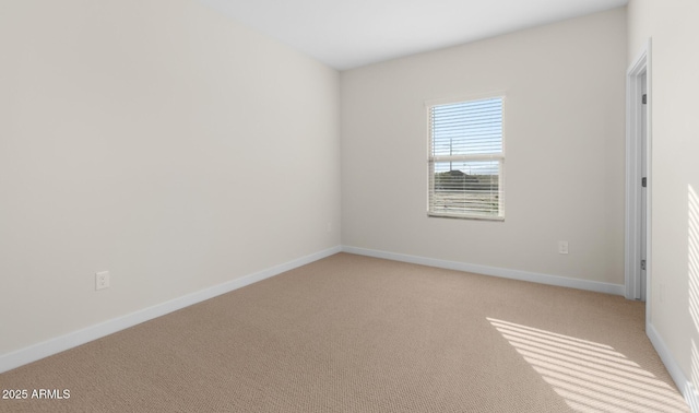 spare room with light colored carpet