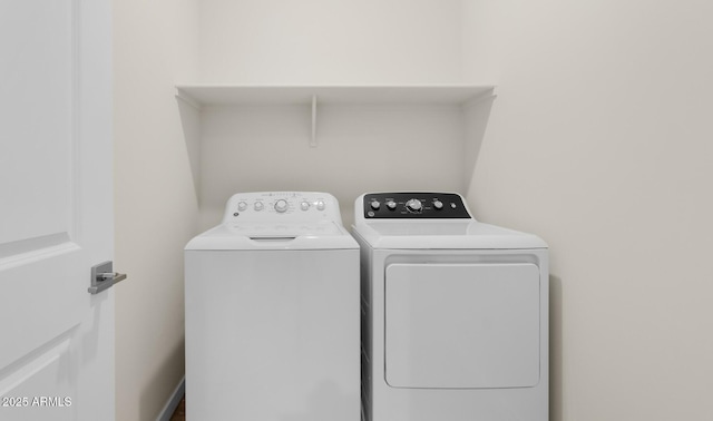 washroom with washer and clothes dryer