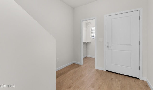 foyer entrance with light hardwood / wood-style floors