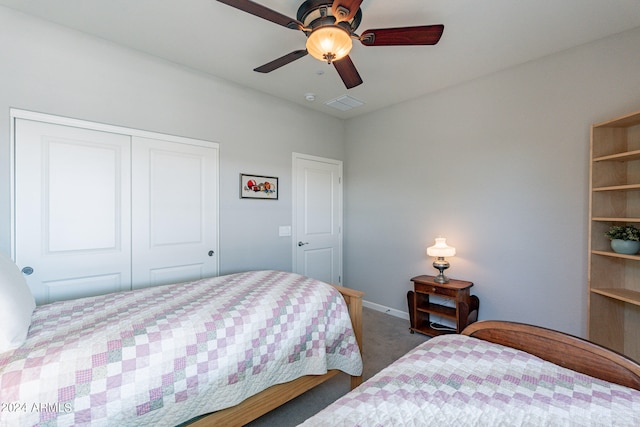 carpeted bedroom with ceiling fan and a closet