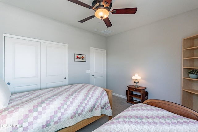 carpeted bedroom featuring baseboards, visible vents, a closet, and a ceiling fan