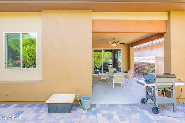 view of patio featuring ceiling fan