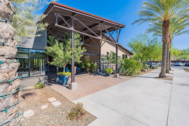 surrounding community featuring a patio area