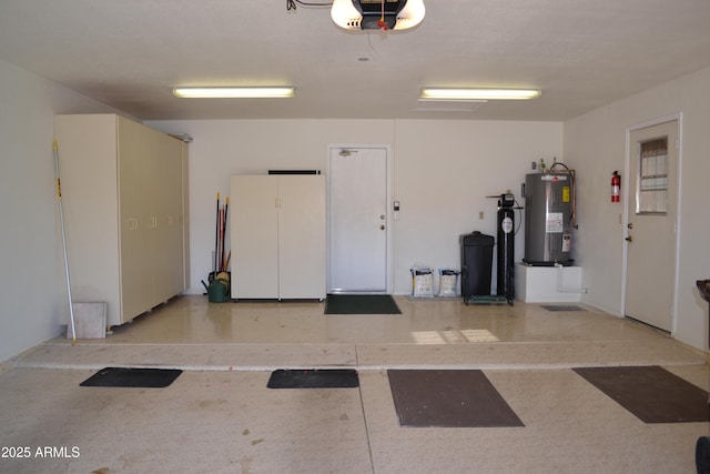9130 W Utopia Rd, Peoria, AZ 85382 - garage with electric water heater, white fridge, and a garage door opener