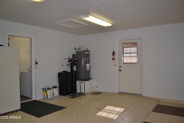 9130 W Utopia Rd, Peoria, AZ 85382 - garage with electric water heater, freestanding refrigerator, and washer / clothes dryer