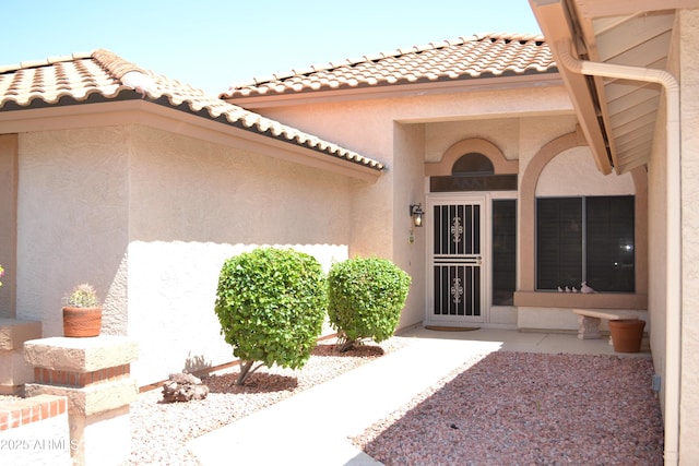 9130 W Utopia Rd, Peoria, AZ 85382 - property entrance with stucco siding and a tile roof