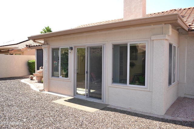 9130 W Utopia Rd, Peoria, AZ 85382 - back of property with a tiled roof, a chimney, and stucco siding