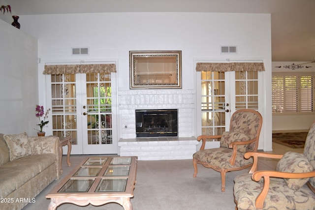 9130 W Utopia Rd, Peoria, AZ 85382 - carpeted living room featuring french doors and a brick fireplace