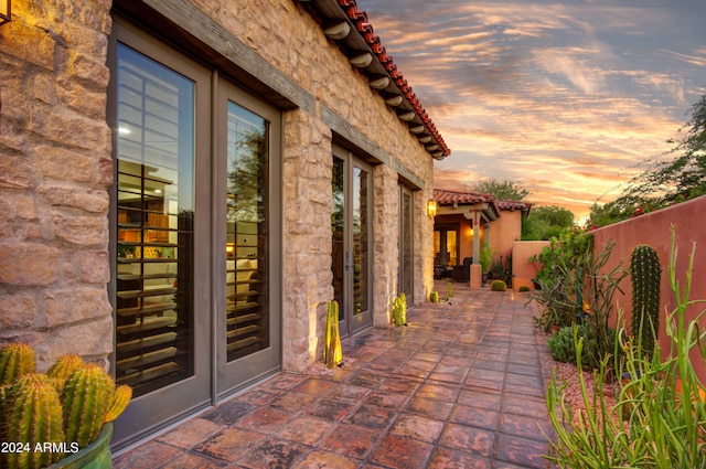 view of patio terrace at dusk