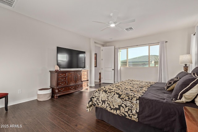 bedroom featuring ceiling fan, dark wood finished floors, visible vents, and baseboards