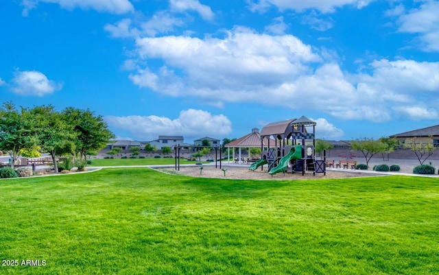 community play area featuring a lawn