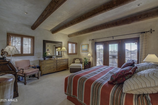 bedroom featuring access to exterior, beamed ceiling, french doors, and carpet