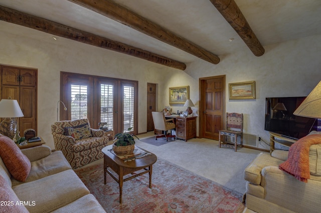 living area featuring beam ceiling, visible vents, and light carpet