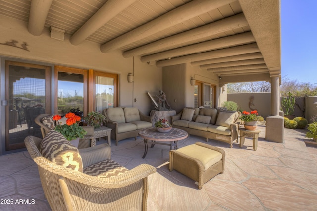 view of patio / terrace with an outdoor living space and fence