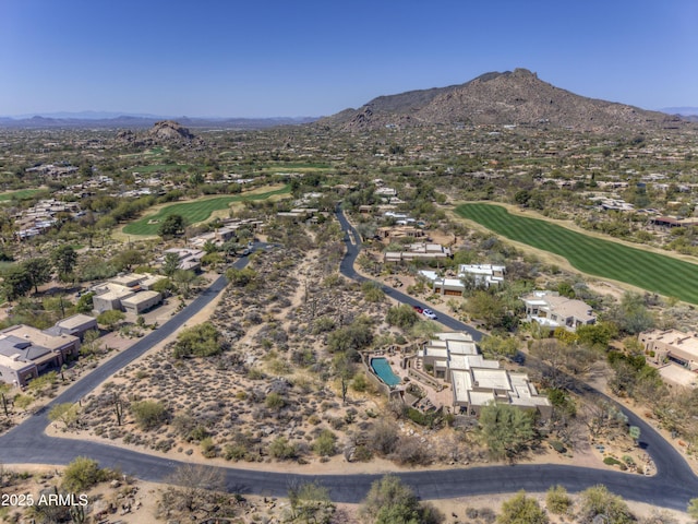 birds eye view of property with a mountain view