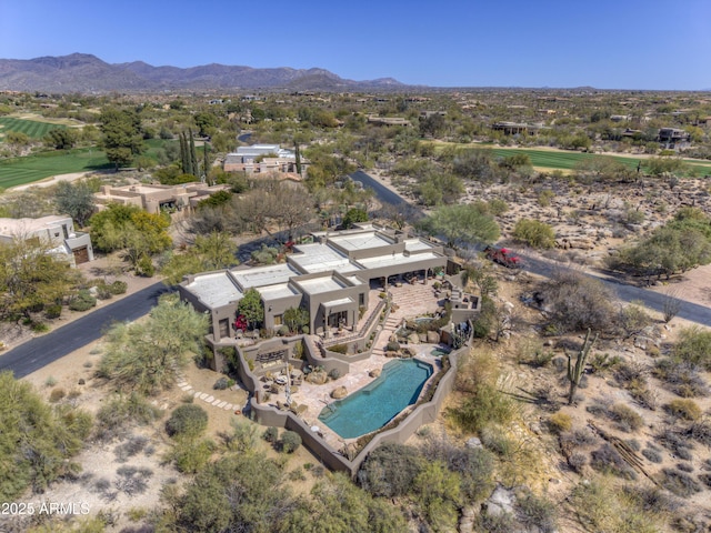 birds eye view of property with a mountain view