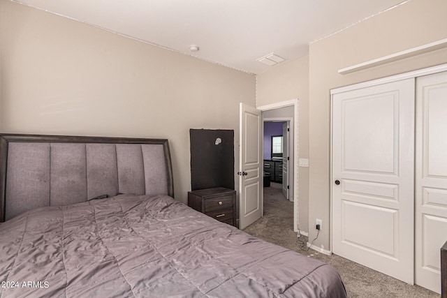 carpeted bedroom featuring a closet