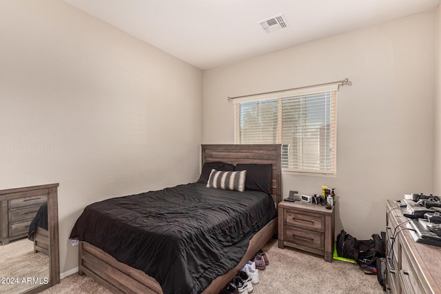 bedroom with light colored carpet