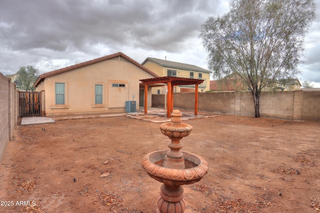 back of property featuring stucco siding, a patio area, a pergola, cooling unit, and a fenced backyard