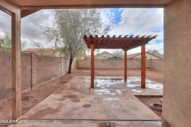 view of patio / terrace featuring a fenced backyard and a pergola