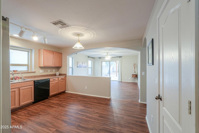 kitchen featuring arched walkways, dark wood-type flooring, visible vents, and dishwasher