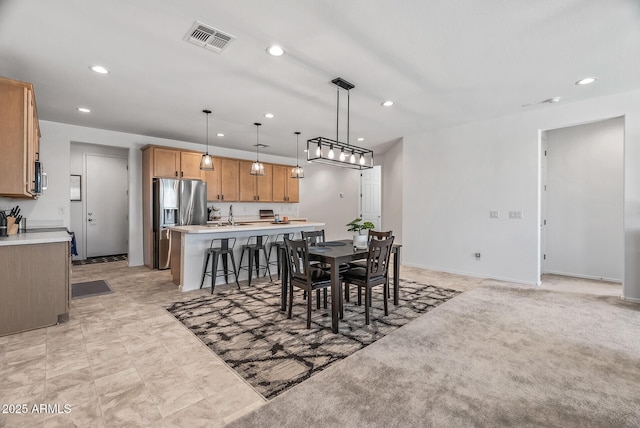 dining space with recessed lighting, visible vents, and baseboards