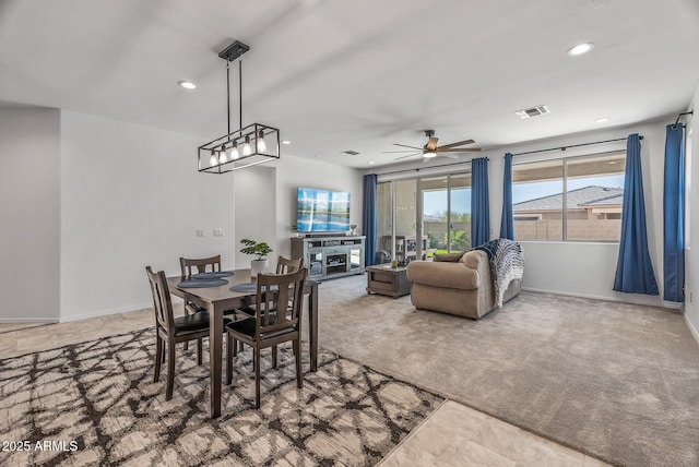 carpeted dining room with visible vents, recessed lighting, a ceiling fan, and baseboards