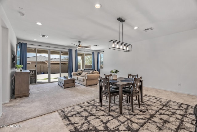 carpeted dining space featuring recessed lighting, visible vents, and baseboards