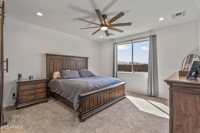 bedroom with recessed lighting, visible vents, light carpet, and ceiling fan