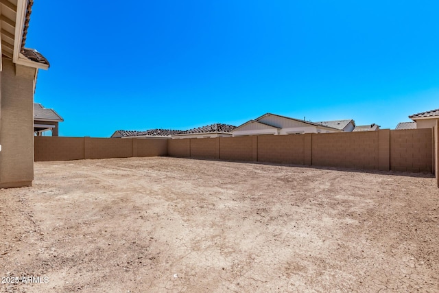 view of yard with a fenced backyard