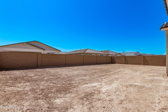 view of yard with a fenced backyard