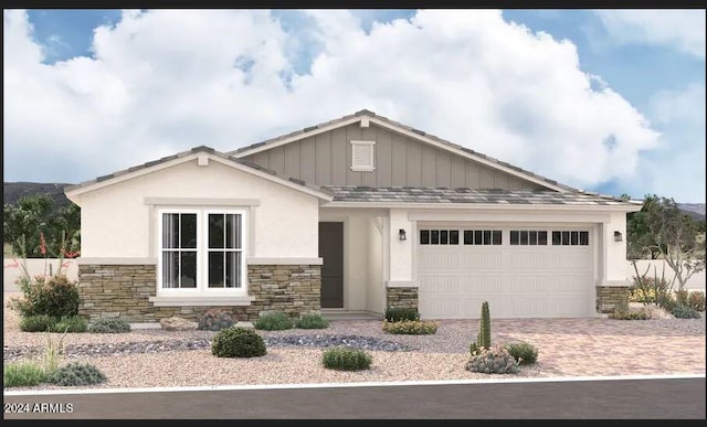 view of front of property featuring stone siding, driveway, a garage, and board and batten siding