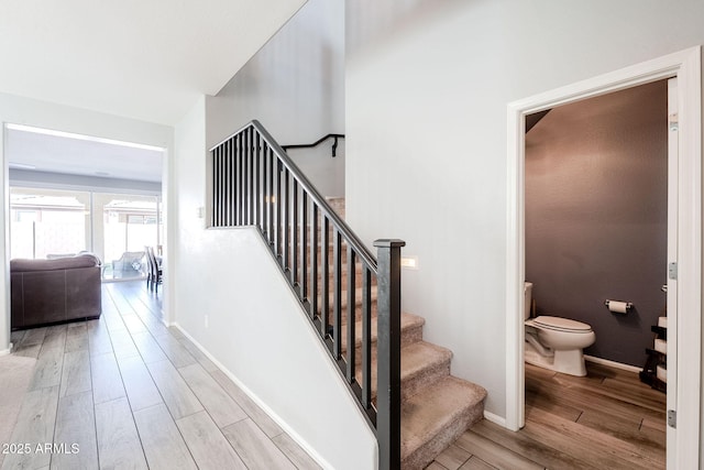 staircase featuring hardwood / wood-style flooring