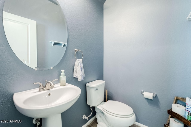 bathroom with sink and toilet