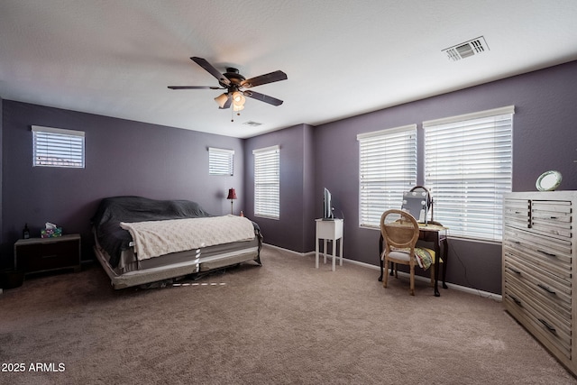 bedroom with ceiling fan and carpet